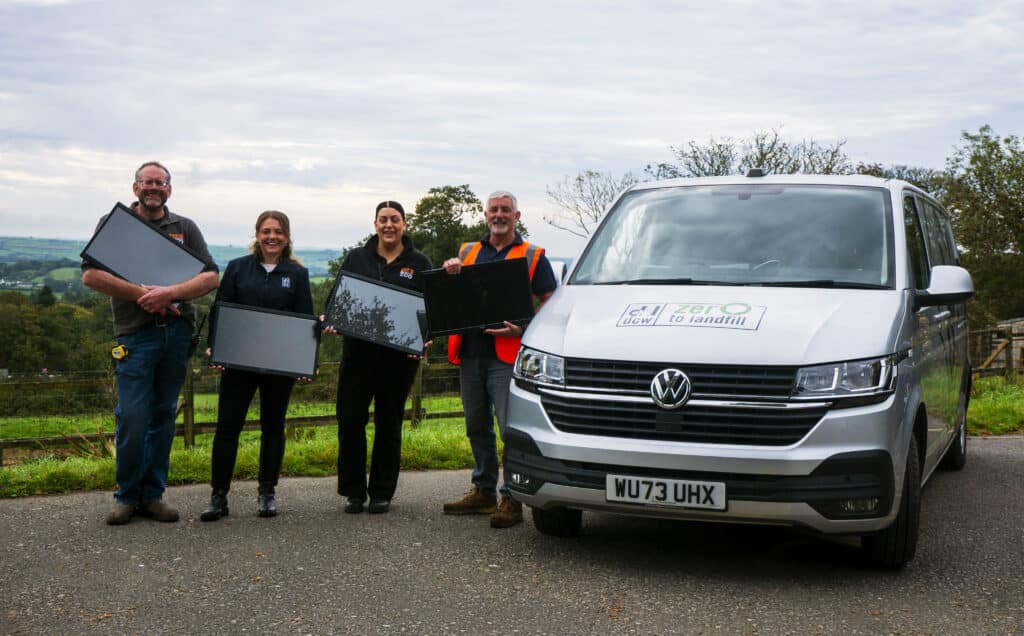Dartmoor zoo and DCW team holding donated monitors.